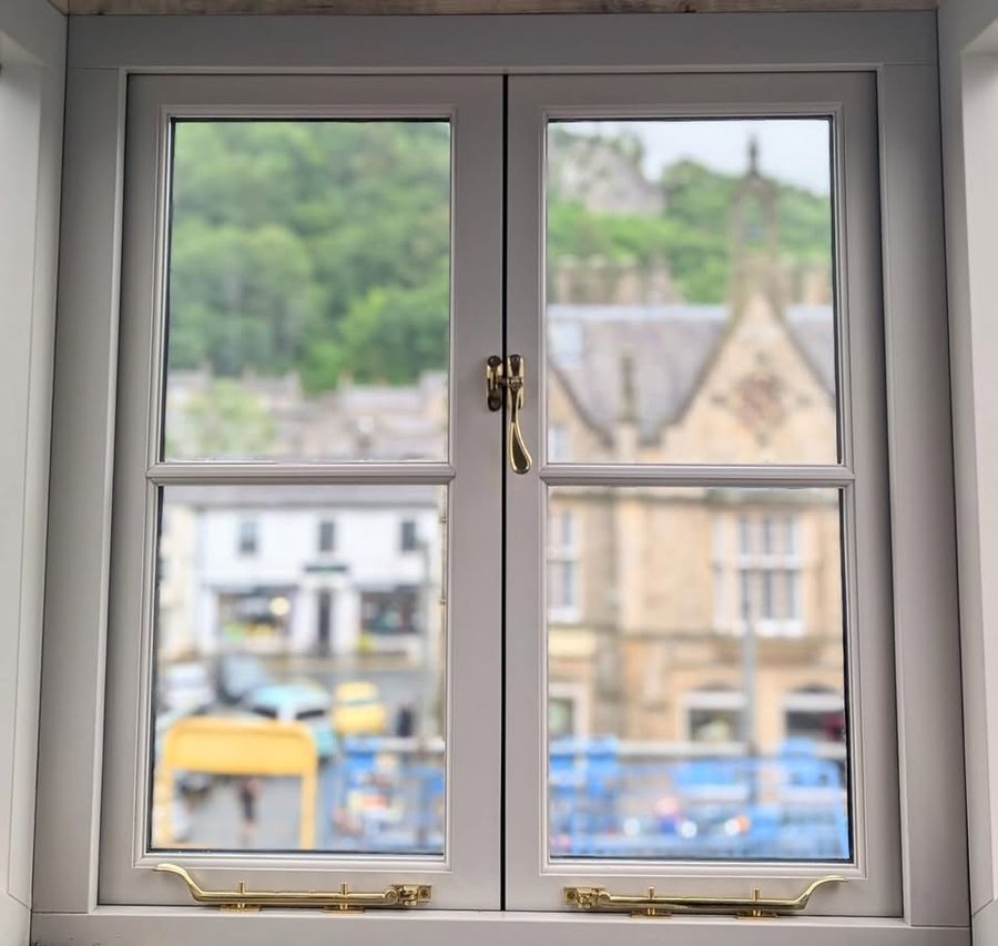 Restored timber sash window overlooking Settle market square